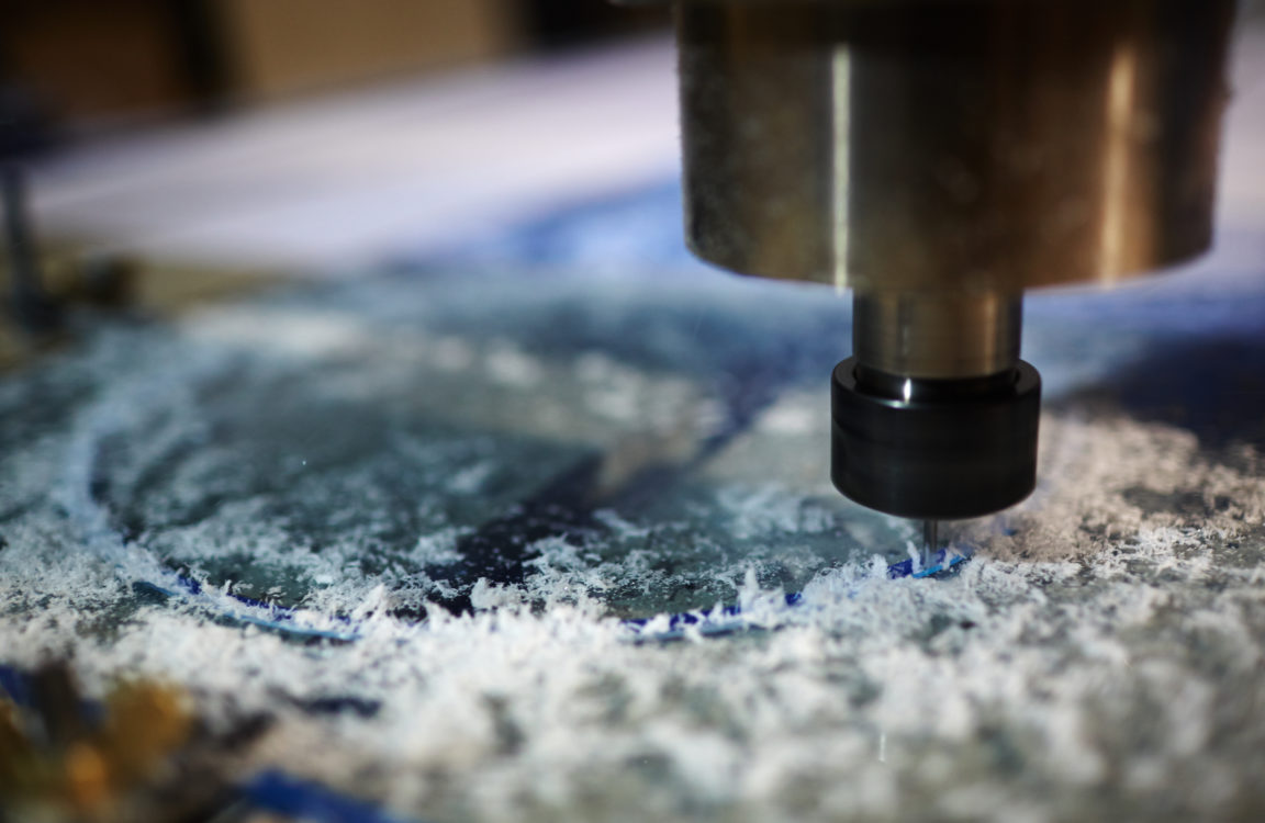 Metallic detail of lathe machine over working surface